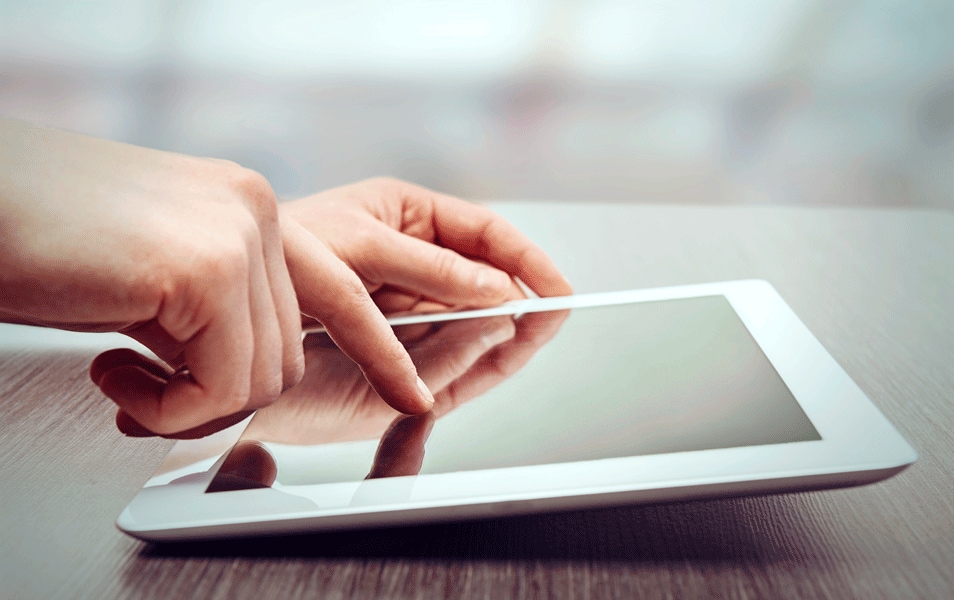 Hands using a tablet to browse cruise options | MSC Cruises Hands using a tablet to browse cruise options | MSC Cruises