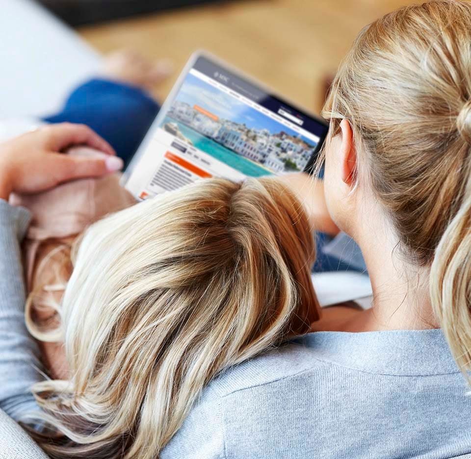 A woman and child browsing MSC Cruises destinations on a tablet | MSC Cruises A woman and child browsing MSC Cruises destinations on a tablet | MSC Cruises
