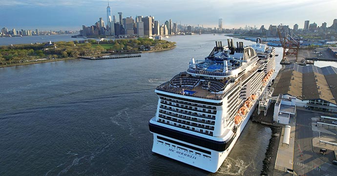MSC Meraviglia docked near New York City with Manhattan skyline in the background | MSC Cruises