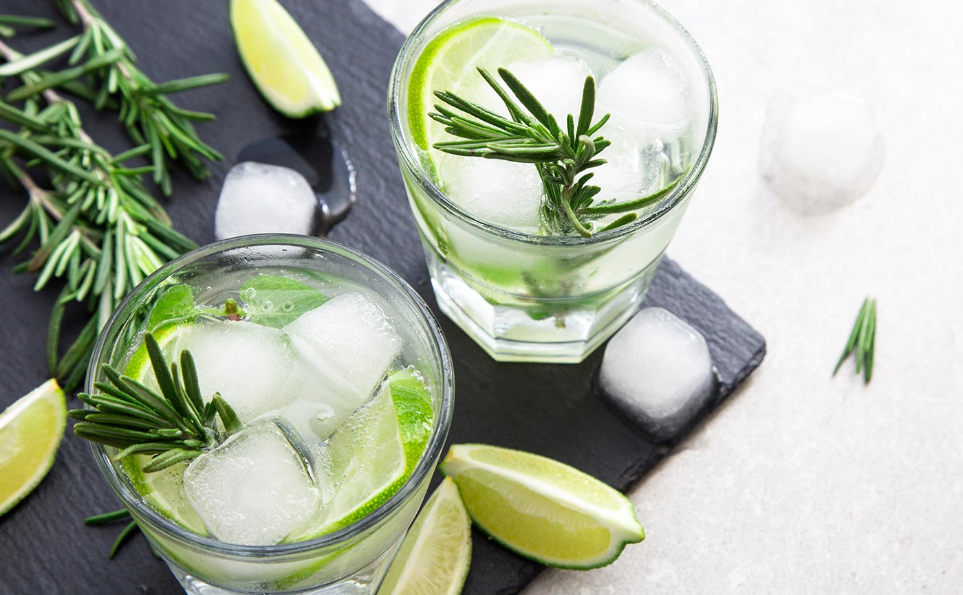 Refreshing cocktails with lime and rosemary on a slate platter | MSC Cruises Refreshing cocktails with lime and rosemary on a slate platter | MSC Cruises