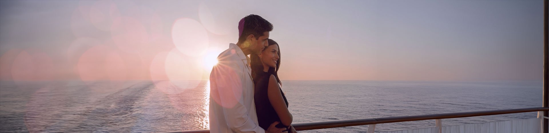 Couple on a ship at sunset | MSC Cruises