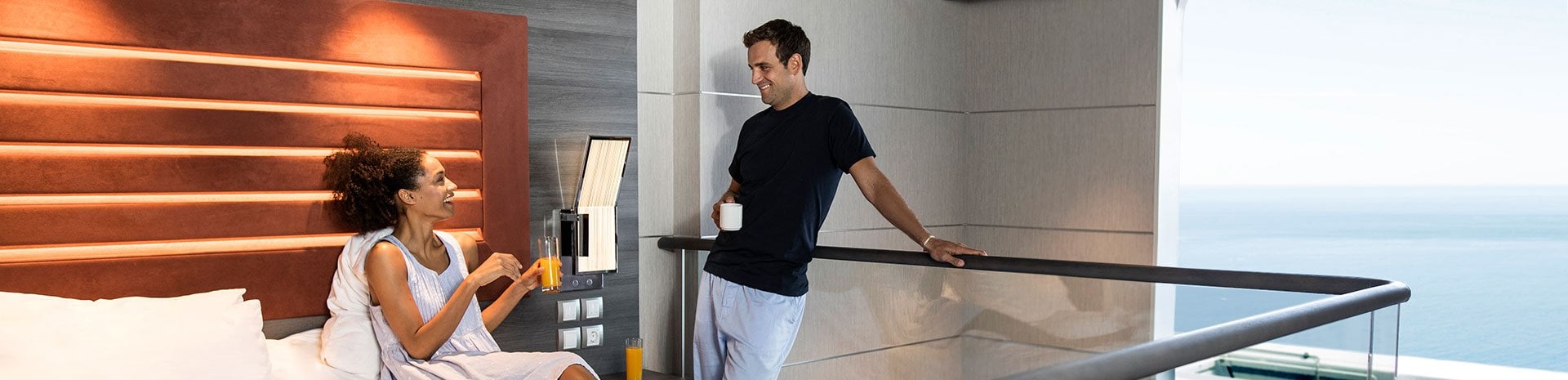 Couple enjoying a balcony stateroom with ocean view on a cruise ship | MSC Cruises Couple enjoying a balcony stateroom with ocean view on a cruise ship | MSC Cruises